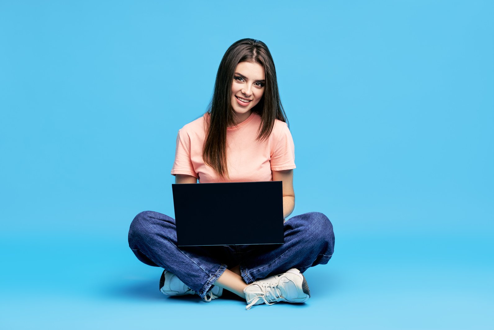 Portrait of Woman Sitting on Floor with Legs Crossed