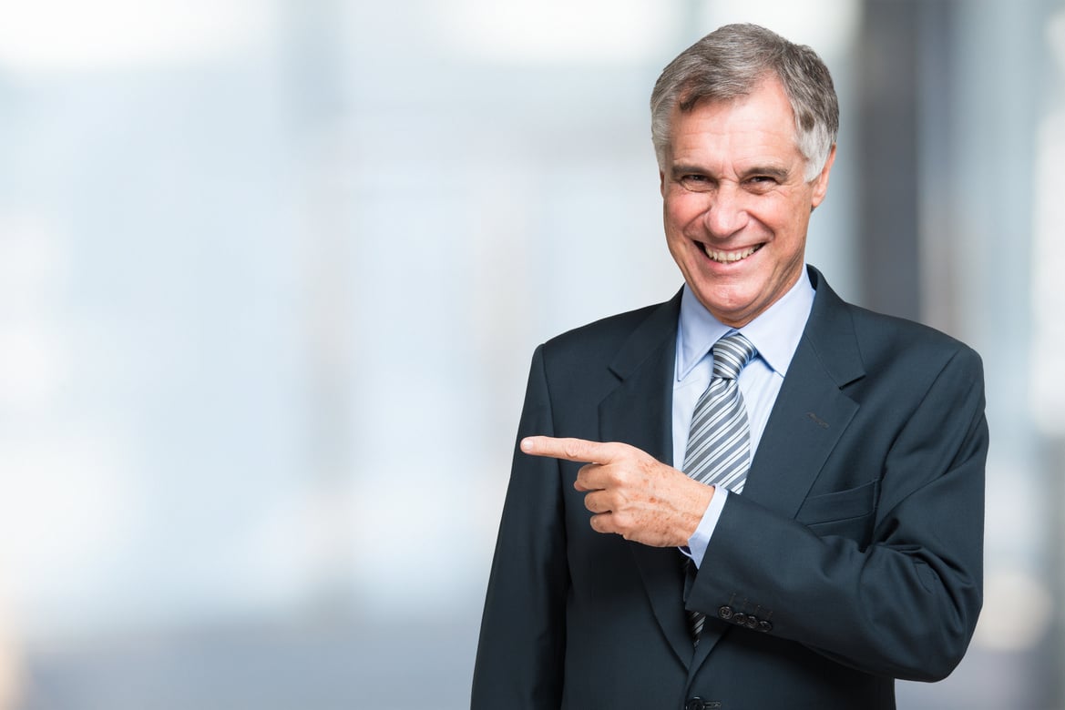 Senior Businessman Pointing His Finger 